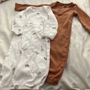 Two gently used 3 month sleepers w/ hand covers.
